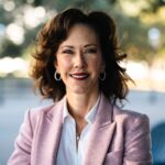 headshot of CEO of friends of foster care in pink blazer.